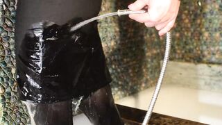 Wetlook in bathroom in black pantyhose, black skirt and white blouse...