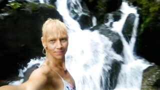 Alexa Cosmic swimming in beautiful waterfall wearing colorful combi dress...