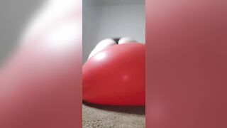 Big Latina booty bouncing on big red balloon