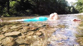 Sexy t-girl swimming in mountain river and wetting teal summer dress ...