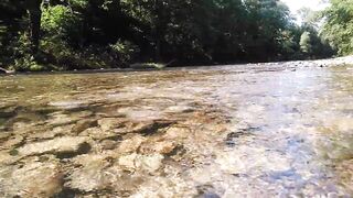 Sexy t-girl swimming in mountain river and wetting teal summer dress ...