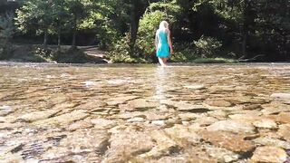 Sexy t-girl swimming in mountain river and wetting teal summer dress ...