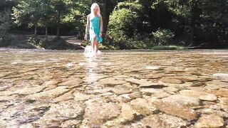 Sexy t-girl swimming in mountain river and wetting teal summer dress ...