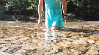 Sexy t-girl swimming in mountain river and wetting teal summer dress ...