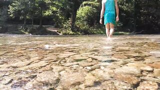 Sexy t-girl swimming in mountain river and wetting teal summer dress ...