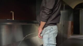 Man pisses in the toilet and plays with his piss