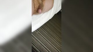 First morning piss laying in bed on two carpet in hotel room