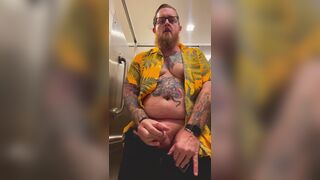 Bearded Tattooed Daddy jerks off in public restroom