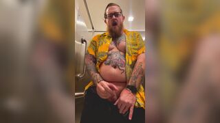 Bearded Tattooed Daddy jerks off in public restroom