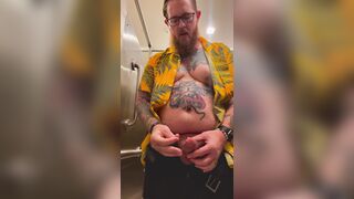 Bearded Tattooed Daddy jerks off in public restroom