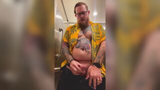 Bearded Tattooed Daddy jerks off in public restroom