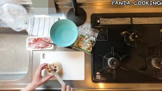 A man wearing pants makes stir-fried lotus root and pork