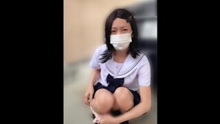 JK姿の女装子が野外駐車場の隅でオナニー