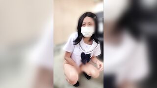 JK姿の女装子が野外駐車場の隅でオナニー