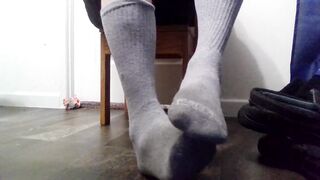 Taking slippers and socks off and rubbing dirty feet!!