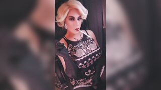 Elegant blonde trans dangles and long cigarette and shows off big cock