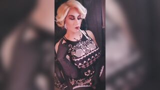 Elegant blonde trans dangles and long cigarette and shows off big cock