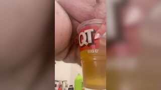 Trans femboy pissing in cup