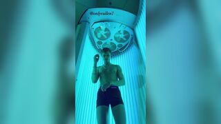 Fit guy enjoys a tense tanning session working out his ???? at the gym