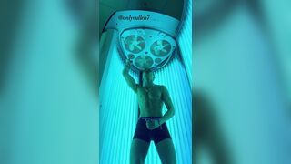 Fit guy enjoys a tense tanning session working out his ???? at the gym