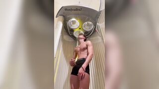 Fit guy enjoys a tense tanning session working out his ???? at the gym