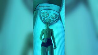 OF guy masturbates his cock while tanning????