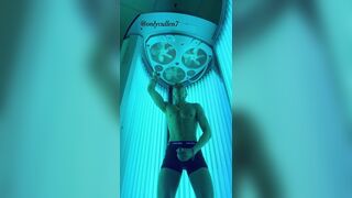 OF guy masturbates his cock while tanning????