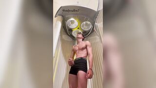 OF guy masturbates his cock while tanning????