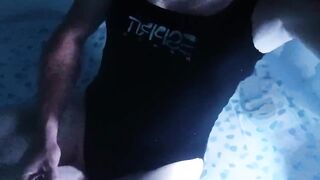 Sissy wearing Black one piece swimsuit on swimming pool