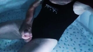 Sissy wearing Black one piece swimsuit on swimming pool