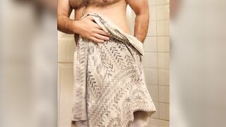 Hairy muscle bear flexing in hot shower