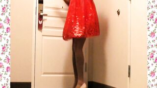 A 1950's SISSY DANCE FOR HER HUSBAND WEARING A PARTY DRESS