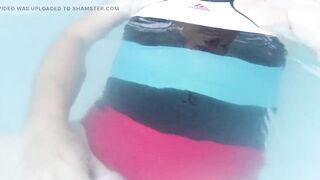 Tranny wearing sexy one piece swimsuit and swimming