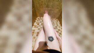 Freshly shaved legs and pussy glisten in the shower