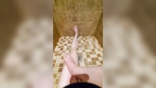 Freshly shaved legs and pussy glisten in the shower