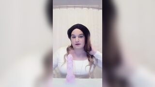 Crossdresser struggles with dildo