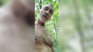 Daddy take a walk in the Wood, stroking his dick, and have his balls bouncing in the outdoors