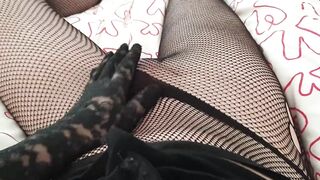 Toni in black fishnet tights touches and strokes her big shaved cock with gloves POV