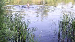 Swimming in lake in clothes. Black Wet skirt, wet stockings and tank top. Wetlook transgirl in lake.