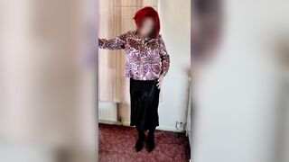 Crossdresser in satin blouse and skirt