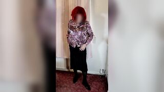 Crossdresser in satin blouse and skirt