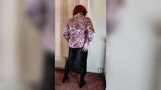 Crossdresser in satin blouse and skirt