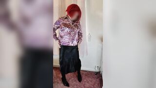 Crossdresser in satin blouse and skirt