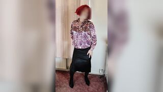 Crossdresser in satin blouse and skirt