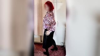 Crossdresser in satin blouse and skirt