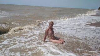 Swimming, splashing and posing naked in the sea...