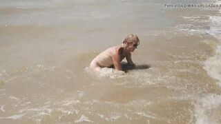 Swimming, splashing and posing naked in the sea...