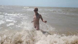 Swimming, splashing and posing naked in the sea...