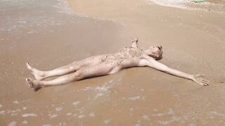 Swimming, splashing and posing naked in the sea...