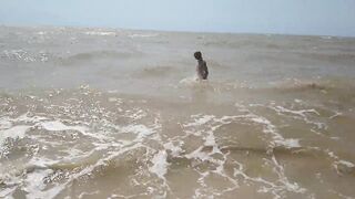 Swimming, splashing and posing naked in the sea...